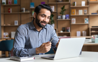 indian man working on laptop