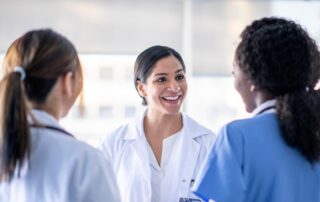 foreign female doctor talking to women doctors