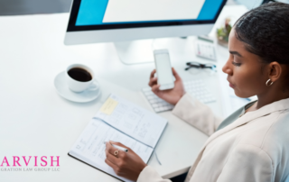 Blog Header Image. African American Woman Holding a phone as she reviews her paper planning calendar to schedule an appointment.